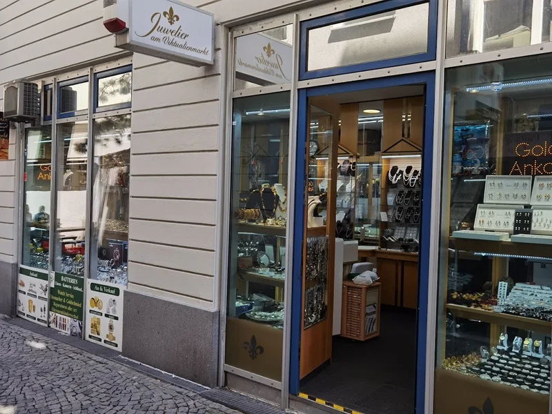 K&K Juwelier München am Viktualienmarkt Uhrmacher Goldschmied Ohrlochstechen Graveur Watch Service Amber Munich Bernstein