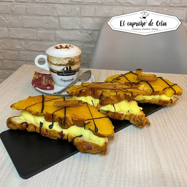 Cafetería El capricho de Celia Panadería y Repostería Artesana.