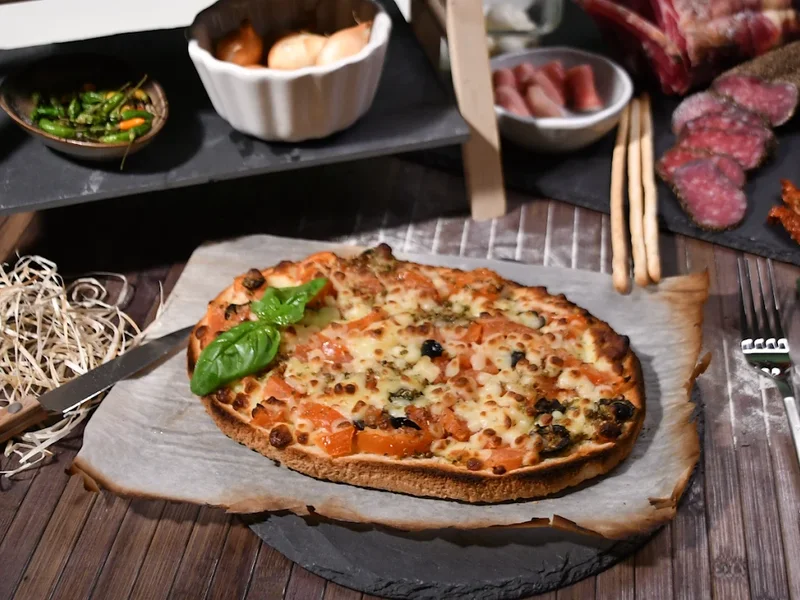 Chouette Pizza à Dijon depuis plus de 30 ans, pizzas artisanales, burger maison, en livraison, sur place et à emporter