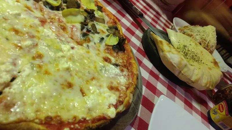 Rino’s Pizzería Cancún