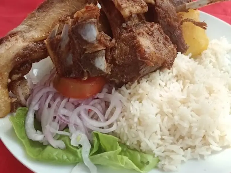 Chancho al Palo Taita Deme