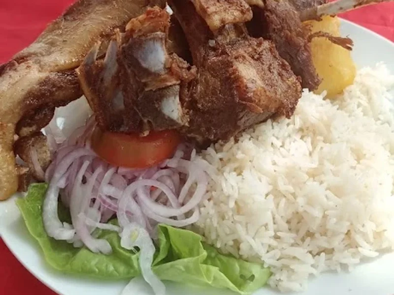 Chancho al Palo Taita Deme