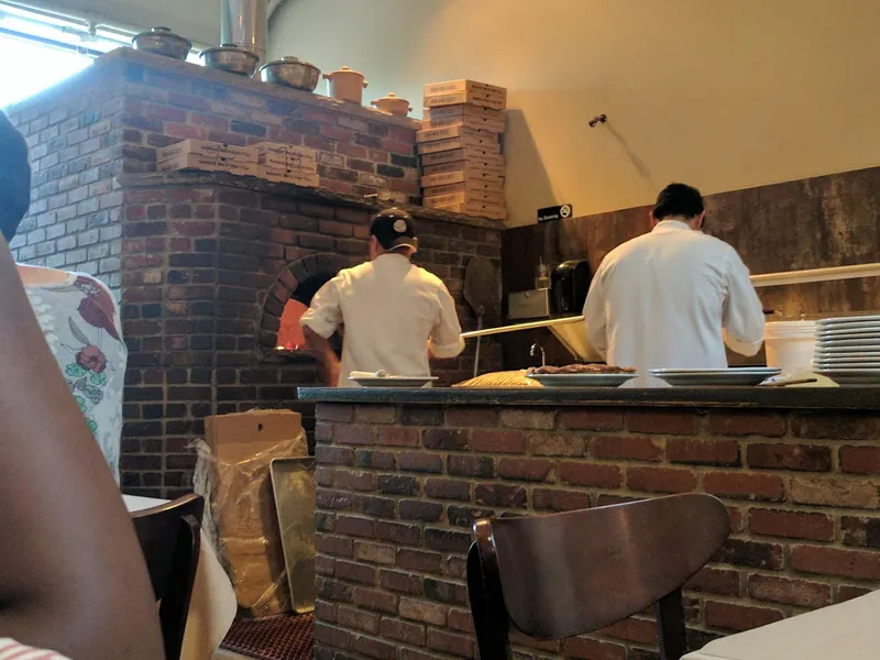 Dining ambiance of restaurant Dee's Wood Fired Pizza + Kitchen 1