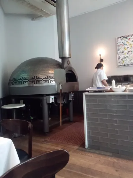 Dining ambiance of restaurant Dee's Wood Fired Pizza + Kitchen 5