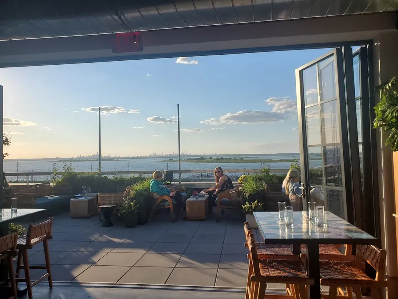 Dining ambiance of restaurant The Roof at The Rockaway Hotel 1