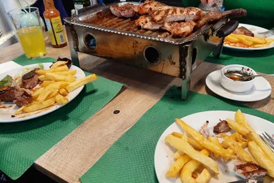 Bar & Parrilla al Carbón La Clásica